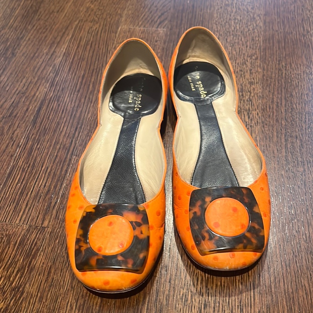 Orange Kate spade flats with tortoise shell detail